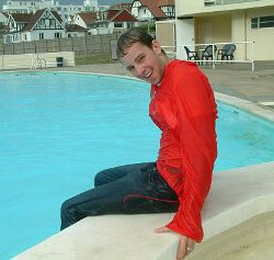 pool boy with anorak in pool